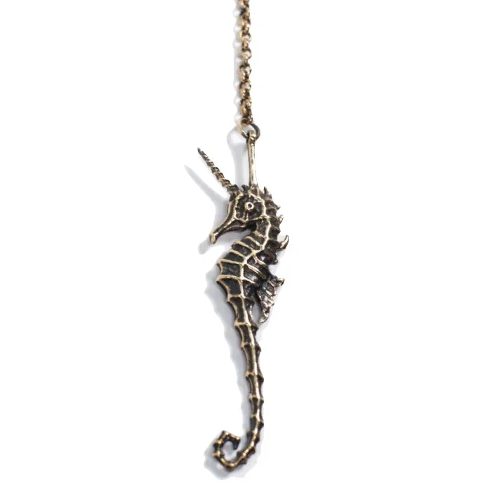 Beautiful necklaces and pendants with diamond halo settings for extra brilliance-seahorse unicorn pendant - brass